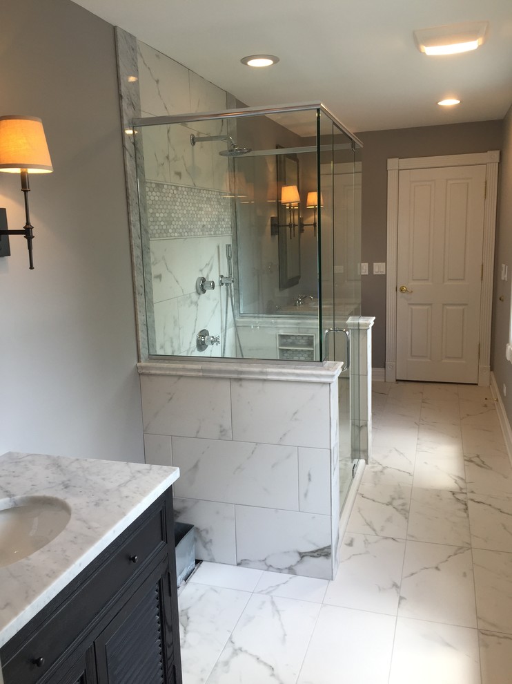 Mid-sized transitional kids' gray tile and stone tile marble floor doorless shower photo in Chicago with louvered cabinets, dark wood cabinets, a two-piece toilet, gray walls, an undermount sink and marble countertops