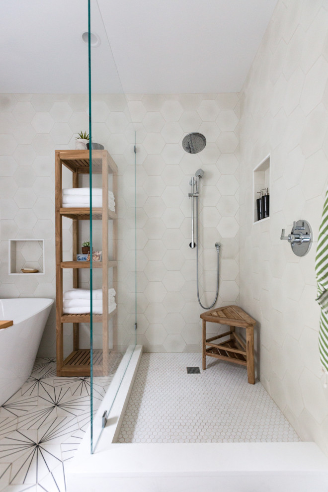 Inspiration for a medium sized contemporary ensuite wet room bathroom in San Francisco with blue cabinets, a freestanding bath, a one-piece toilet, multi-coloured tiles, mosaic tile flooring, a submerged sink, engineered stone worktops, a hinged door and white worktops.