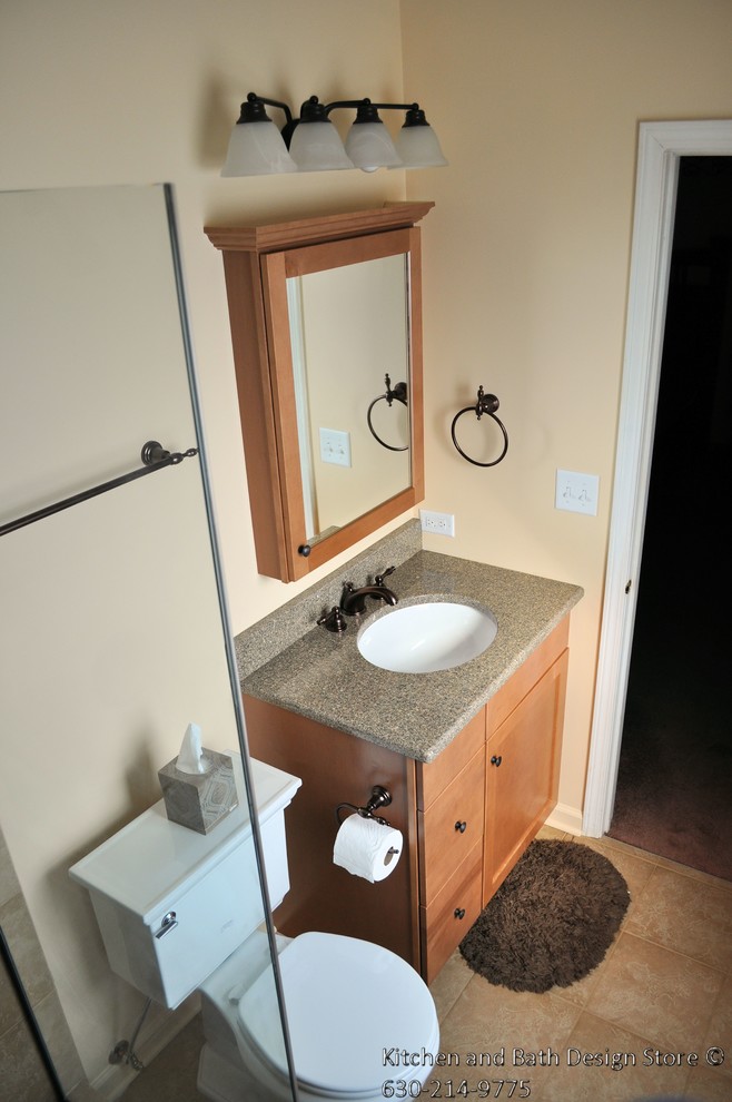 Medium sized traditional ensuite bathroom in Chicago with a submerged sink, shaker cabinets, light wood cabinets, granite worktops, an alcove shower, a two-piece toilet, brown tiles, porcelain tiles, beige walls and porcelain flooring.