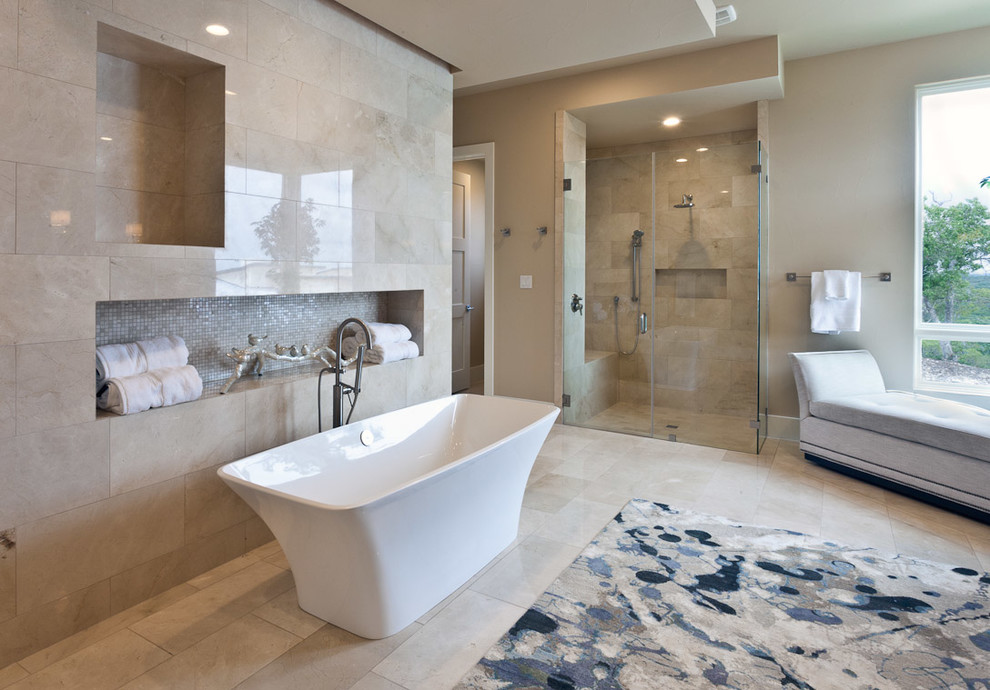 This is an example of a medium sized traditional ensuite bathroom in Nashville with flat-panel cabinets, medium wood cabinets, a freestanding bath, a corner shower, beige tiles, travertine tiles, beige walls, travertine flooring, a submerged sink and engineered stone worktops.