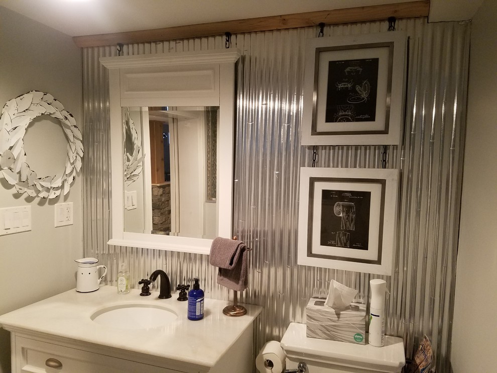 Small farmhouse 3/4 ceramic tile and gray floor alcove shower photo in Chicago with recessed-panel cabinets, white cabinets, a two-piece toilet, gray walls, an undermount sink, marble countertops, a hinged shower door and white countertops