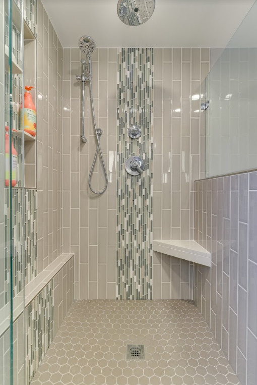 Inspiration for a mid-sized gray tile and subway tile porcelain tile and white floor corner shower remodel in Portland with recessed-panel cabinets, gray cabinets, a one-piece toilet, gray walls, an undermount sink, quartz countertops, a hinged shower door and white countertops
