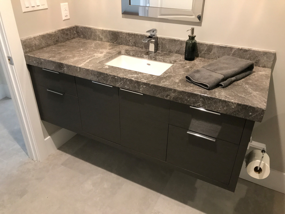 Inspiration for a medium sized modern ensuite bathroom in Philadelphia with flat-panel cabinets, grey cabinets, a double shower, a two-piece toilet, grey tiles, matchstick tiles, white walls, ceramic flooring, a submerged sink, marble worktops, grey floors, a hinged door, grey worktops, a single sink and a floating vanity unit.
