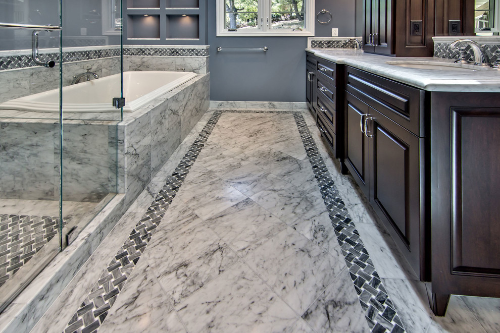 Inspiration for a timeless gray tile and stone tile bathroom remodel in San Francisco with an undermount sink, dark wood cabinets, marble countertops, a one-piece toilet and raised-panel cabinets