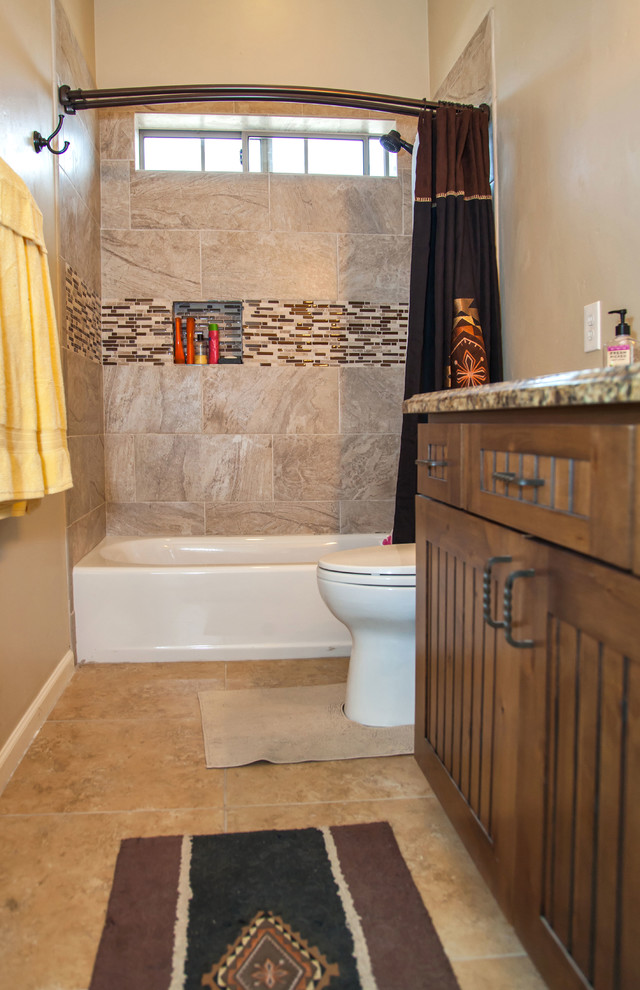 Mid-sized transitional kids' beige tile and stone tile travertine floor tub/shower combo photo in Phoenix with louvered cabinets, medium tone wood cabinets, a one-piece toilet, white walls, an undermount sink and granite countertops