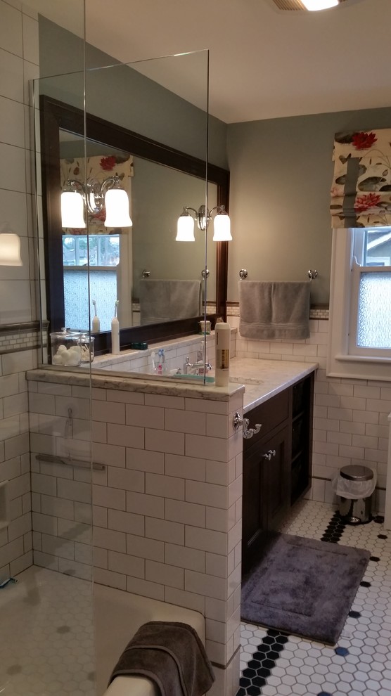 Inspiration for a mid-sized craftsman master white tile and ceramic tile ceramic tile bathroom remodel in Columbus with an undermount sink, shaker cabinets, dark wood cabinets, quartz countertops, a two-piece toilet and green walls