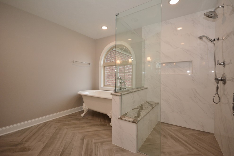 Large elegant master white tile and porcelain tile porcelain tile and gray floor bathroom photo in Other with beaded inset cabinets, gray cabinets, a two-piece toilet, gray walls, an undermount sink, quartz countertops, a hinged shower door and white countertops