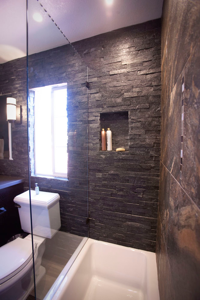Example of a mid-sized transitional brown tile and porcelain tile dark wood floor and brown floor bathroom design in Los Angeles with shaker cabinets, dark wood cabinets, a two-piece toilet, brown walls, an undermount sink, quartz countertops and a hinged shower door