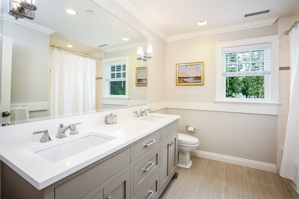 Small transitional kids' white tile and porcelain tile porcelain tile bathroom photo in New York with flat-panel cabinets, beige cabinets, beige walls, an undermount sink and quartz countertops
