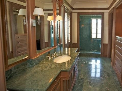 Example of a stone tile marble floor bathroom design in Dallas with marble countertops