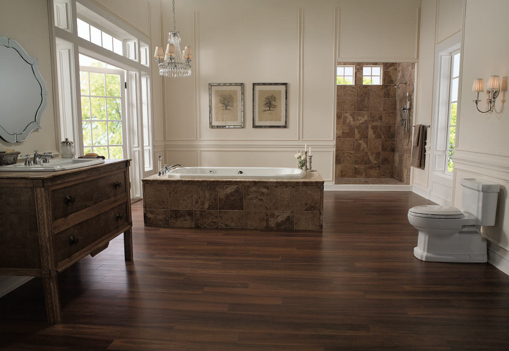 Inspiration for a large timeless master dark wood floor and brown floor bathroom remodel in Dallas with a one-piece toilet, a drop-in sink, shaker cabinets, dark wood cabinets, beige walls and wood countertops
