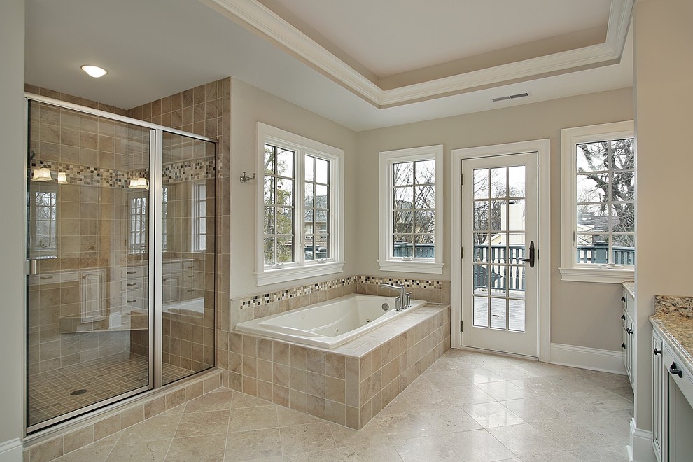 Example of a large classic master beige tile and porcelain tile travertine floor bathroom design in San Francisco with furniture-like cabinets, white cabinets, granite countertops and beige walls