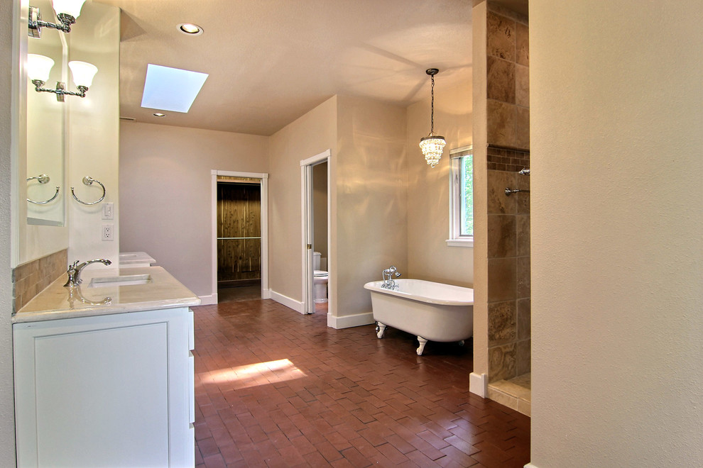 Large 1960s master brown tile and stone tile brick floor bathroom photo in Albuquerque with an undermount sink, furniture-like cabinets, marble countertops, a two-piece toilet and beige walls