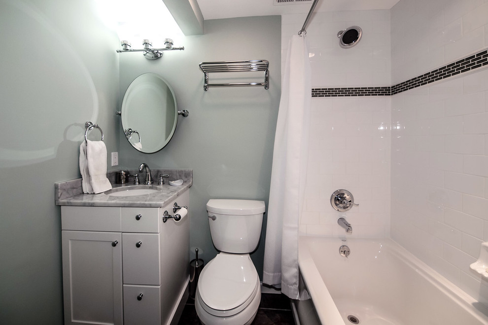 Bathroom - small contemporary white tile bathroom idea in DC Metro with an undermount sink, recessed-panel cabinets, white cabinets, granite countertops, a two-piece toilet and green walls