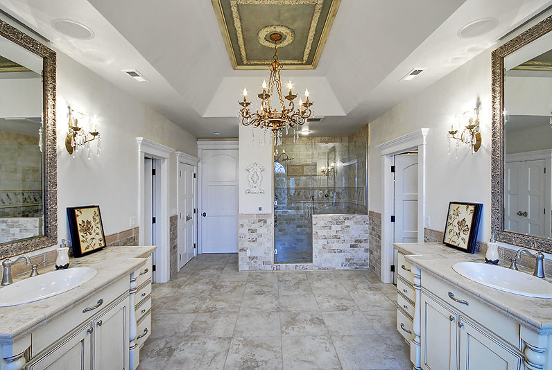 Traditional bathroom in Seattle with recessed-panel cabinets, distressed cabinets and porcelain flooring.