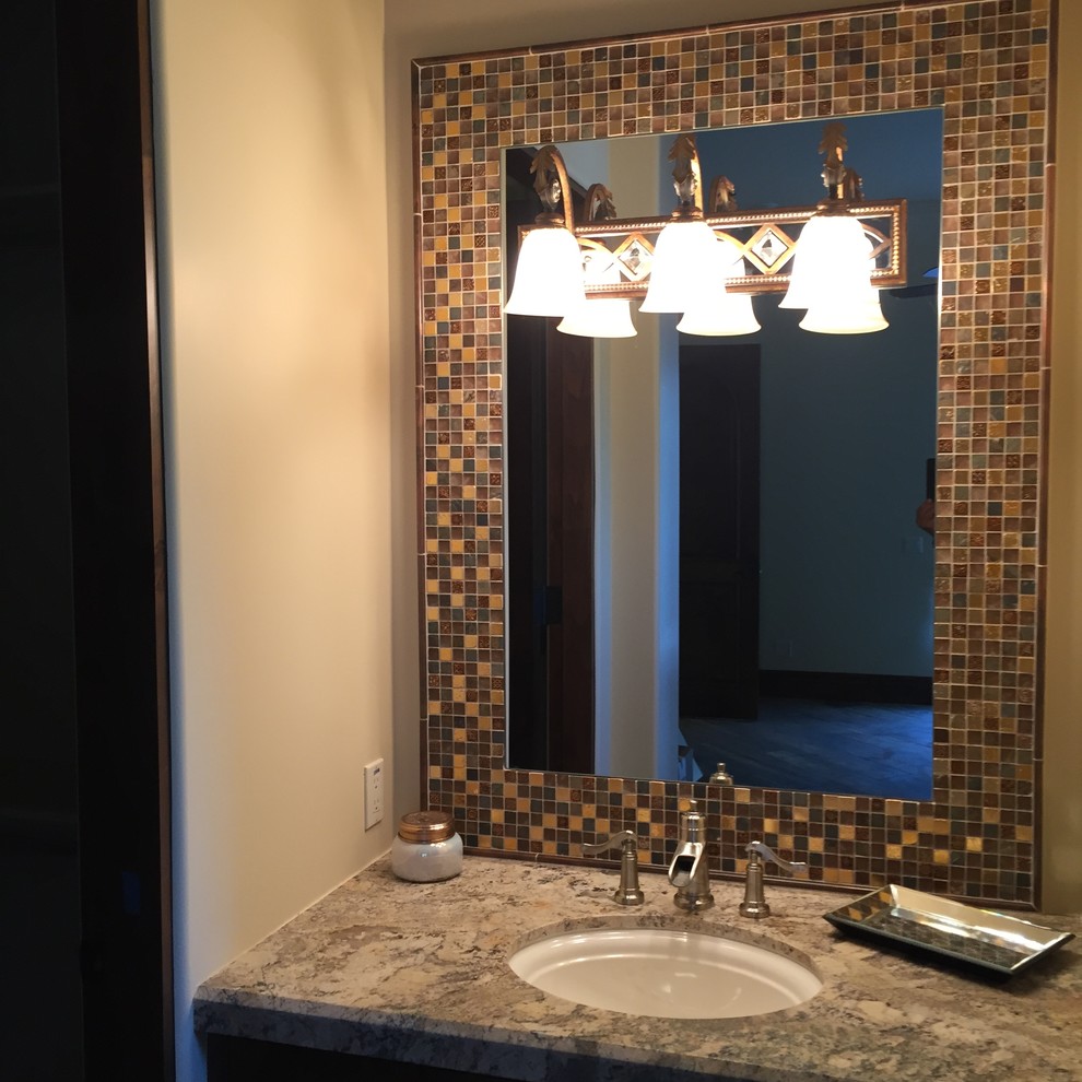 Bathroom - small mediterranean brown tile and mosaic tile bathroom idea in Phoenix with an undermount sink and granite countertops