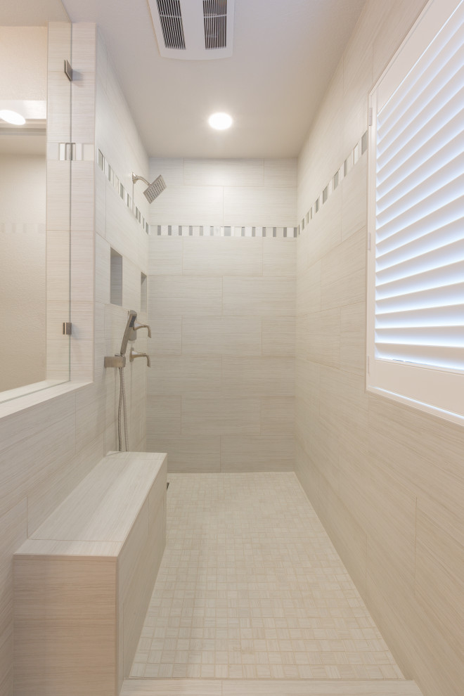 Photo of a modern ensuite bathroom in Sacramento with white cabinets, a walk-in shower, white tiles, white walls, porcelain flooring, a submerged sink, brown floors and an open shower.