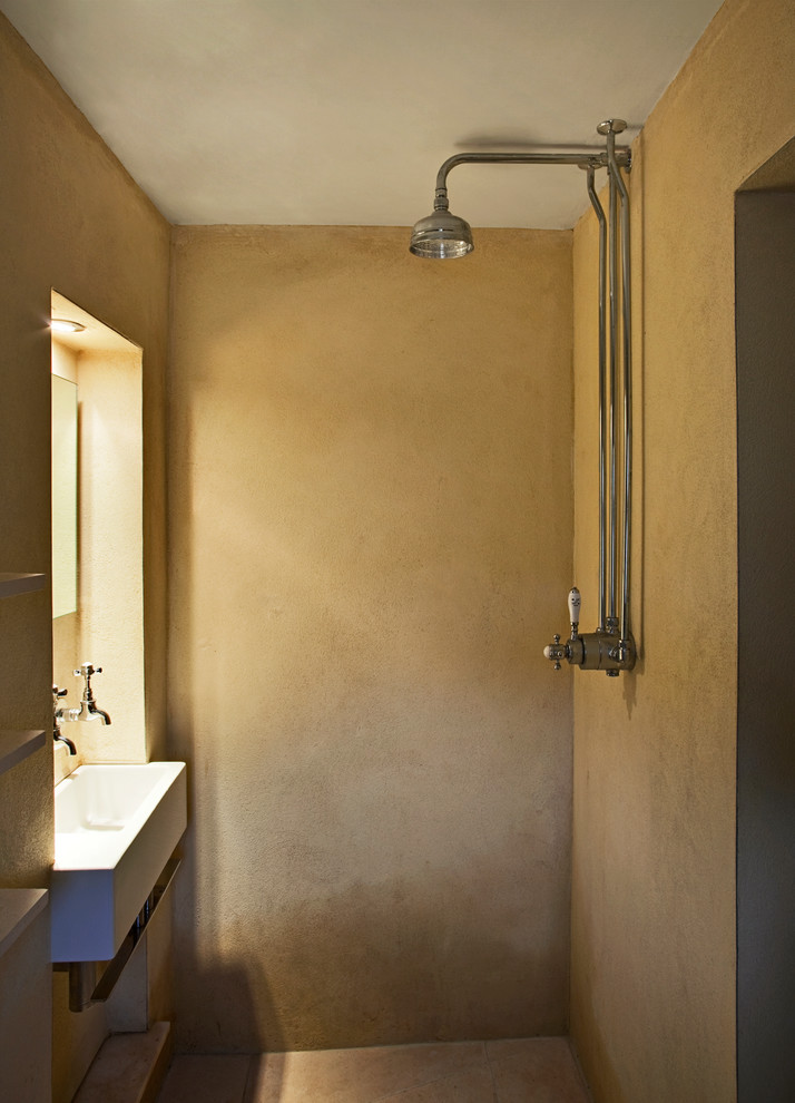 Bathroom - small contemporary limestone tile limestone floor bathroom idea in Devon with an integrated sink, a two-piece toilet and yellow walls