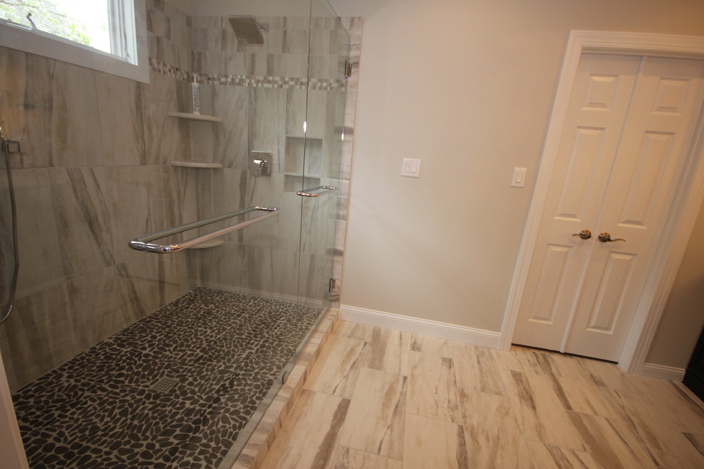 This is an example of a contemporary ensuite bathroom in Raleigh with granite worktops, porcelain tiles and porcelain flooring.