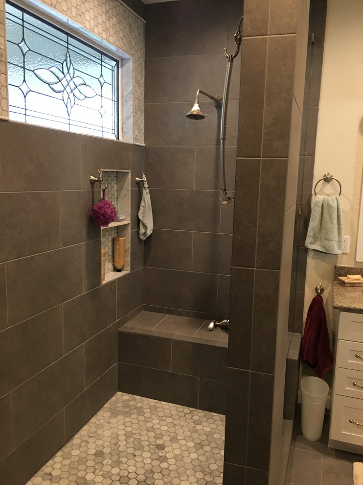 Large traditional ensuite bathroom in Denver with shaker cabinets, white cabinets, a walk-in shower, grey tiles, porcelain tiles, grey walls, porcelain flooring, a submerged sink, engineered stone worktops, grey floors, an open shower and grey worktops.