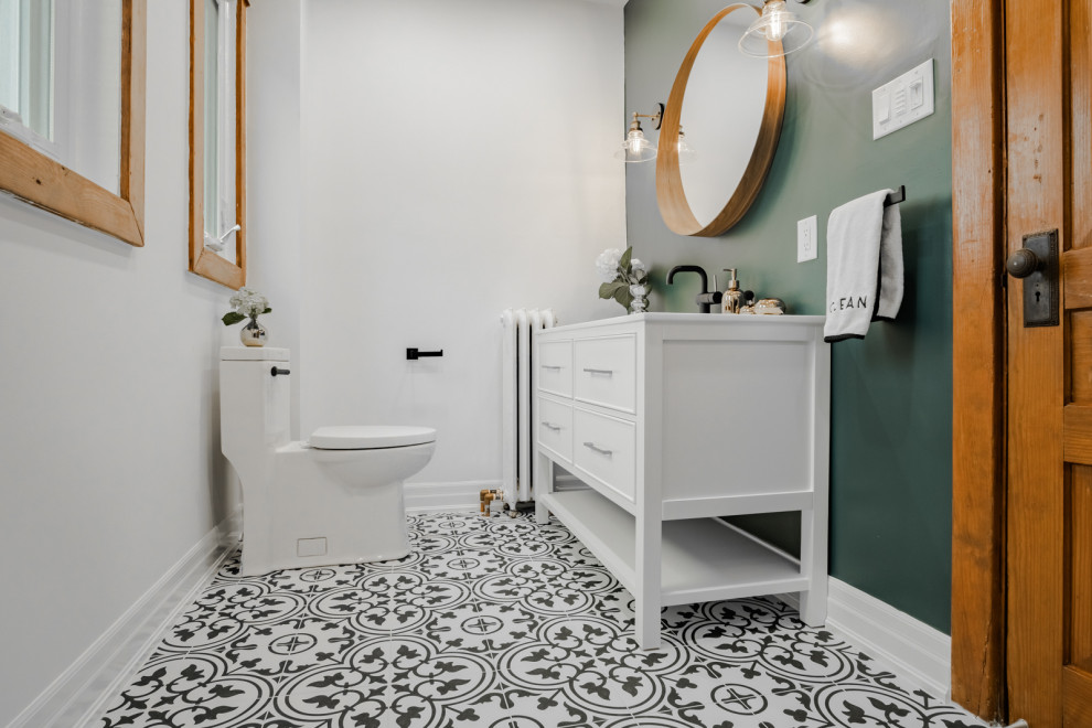 Inspiration for a large country ensuite bathroom in Toronto with white cabinets, an alcove shower, a one-piece toilet, green tiles, green walls, cement flooring, a submerged sink, engineered stone worktops, a sliding door, white worktops, glass-front cabinets and a freestanding vanity unit.
