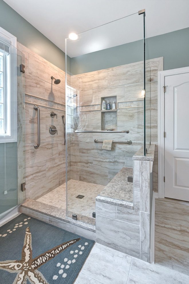 Inspiration for a beach style ensuite bathroom in Charleston with dark wood cabinets, a two-piece toilet, beige tiles, porcelain tiles, blue walls, porcelain flooring, a submerged sink, granite worktops, beige floors, a hinged door and beige worktops.