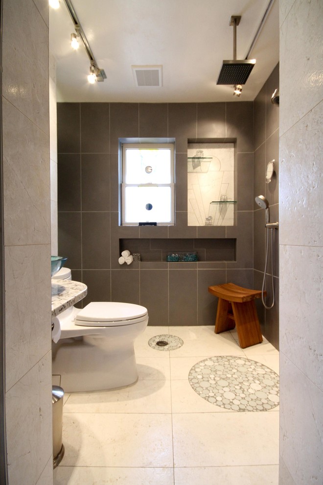 Photo of a medium sized contemporary bathroom in St Louis with a one-piece toilet, grey tiles, porcelain tiles, beige walls, limestone flooring, a vessel sink, granite worktops, beige floors and an open shower.