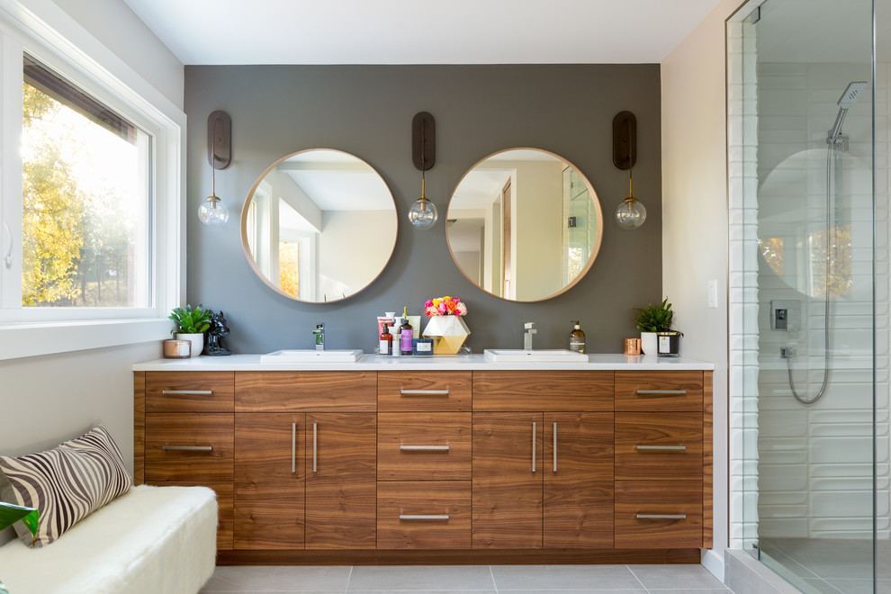 This is an example of a large midcentury ensuite bathroom in Other with flat-panel cabinets, medium wood cabinets, an alcove shower, white tiles, white walls, ceramic flooring, a vessel sink, quartz worktops, grey floors and an open shower.