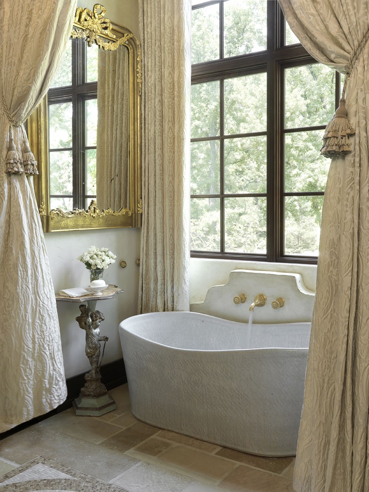 Photo of a traditional bathroom in St Louis with a freestanding bath.