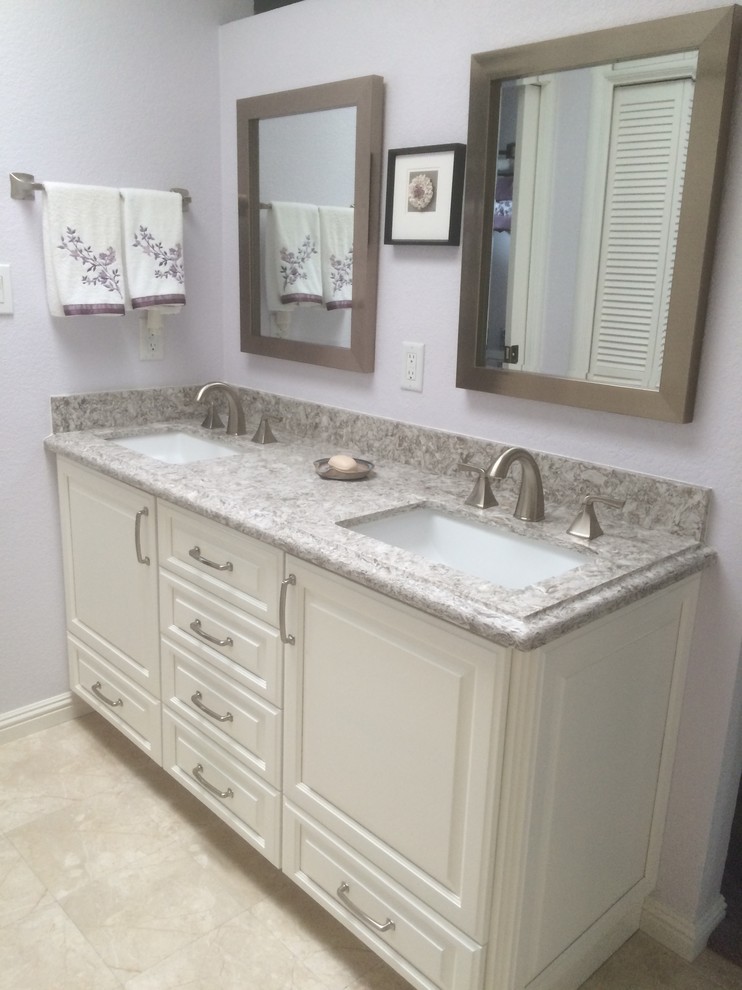 This is an example of a medium sized classic ensuite bathroom in Sacramento with raised-panel cabinets, white cabinets, ceramic flooring, purple walls and a submerged sink.