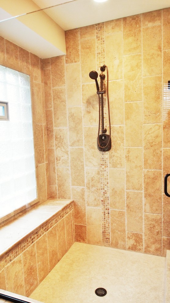На фото: главная ванная комната в средиземноморском стиле с темными деревянными фасадами, столешницей из кварцита, накладной ванной, бежевой плиткой и терракотовой плиткой