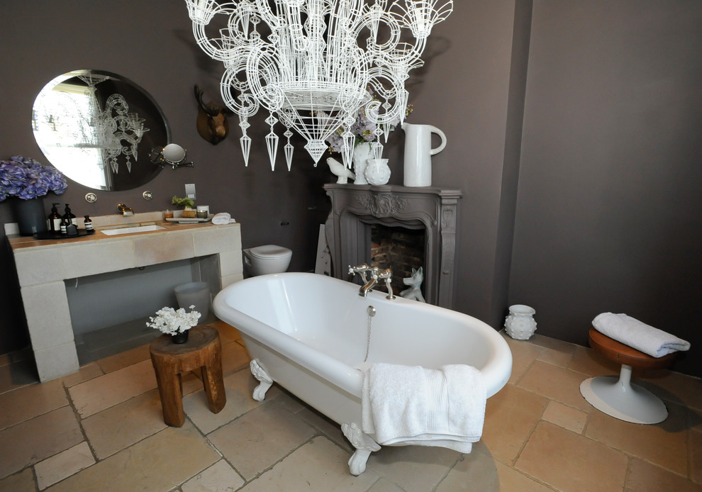Design ideas for an eclectic bathroom in London with a claw-foot bath and a chimney breast.