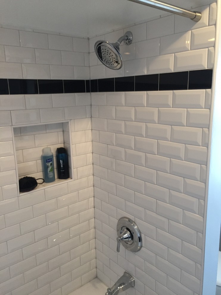 Small traditional ensuite bathroom in Chicago with raised-panel cabinets, dark wood cabinets, an alcove shower, a two-piece toilet, white tiles, ceramic tiles, porcelain flooring, an integrated sink and solid surface worktops.
