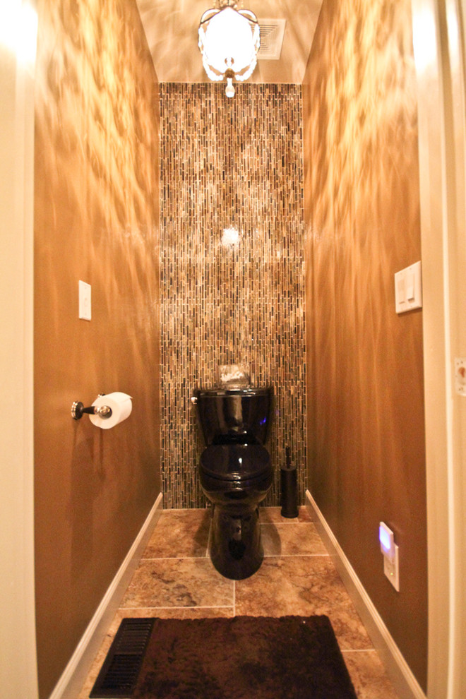 Photo of a large contemporary cloakroom in St Louis with raised-panel cabinets, black cabinets, a two-piece toilet, beige tiles, ceramic tiles, brown walls, travertine flooring, a vessel sink, granite worktops and beige floors.