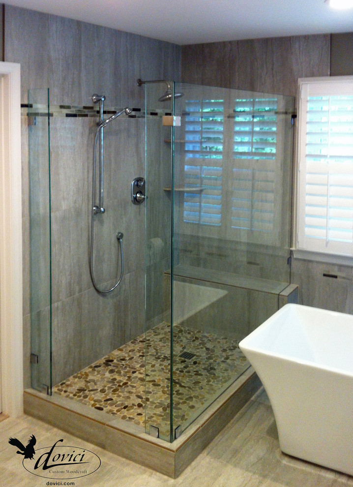 Inspiration for a contemporary bathroom in DC Metro with a freestanding bath, a corner shower and brown tiles.