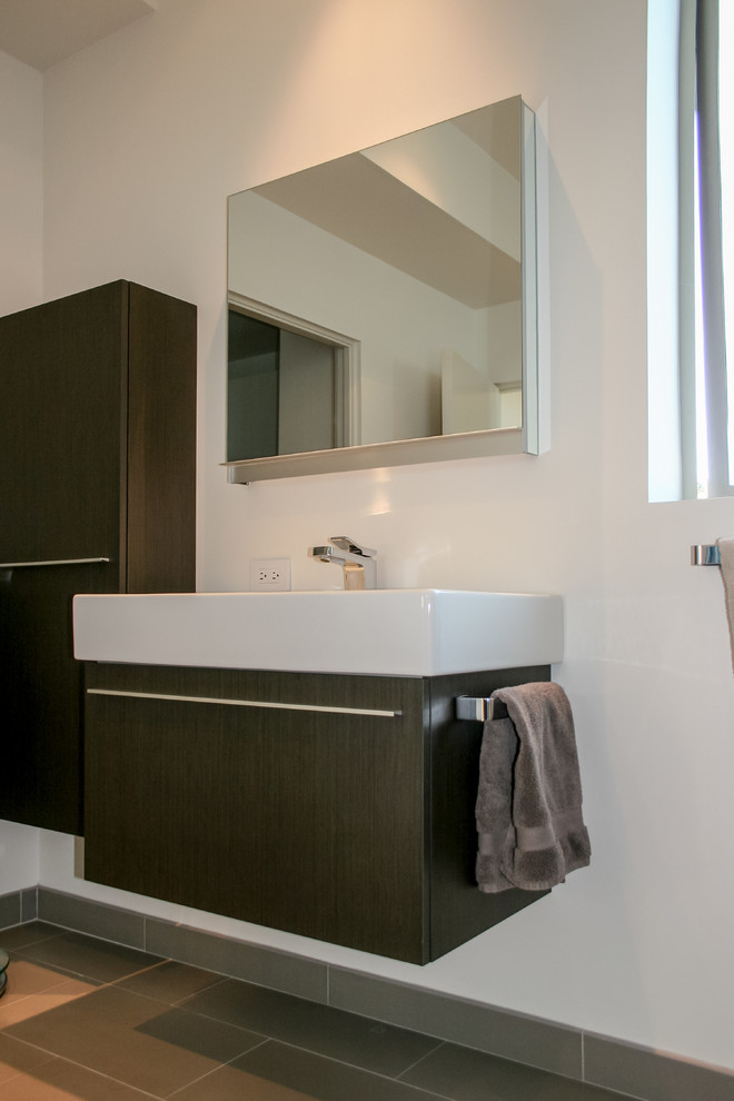 Design ideas for a medium sized contemporary ensuite bathroom in San Francisco with flat-panel cabinets, dark wood cabinets, a corner shower, a one-piece toilet, brown tiles, porcelain tiles, white walls and porcelain flooring.
