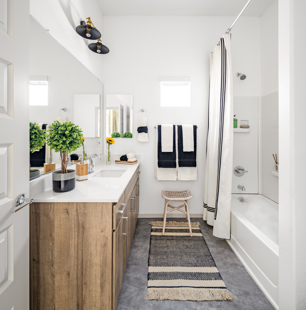Example of a trendy white tile gray floor and single-sink bathroom design in Phoenix with flat-panel cabinets, medium tone wood cabinets, white walls, an undermount sink, white countertops and a built-in vanity