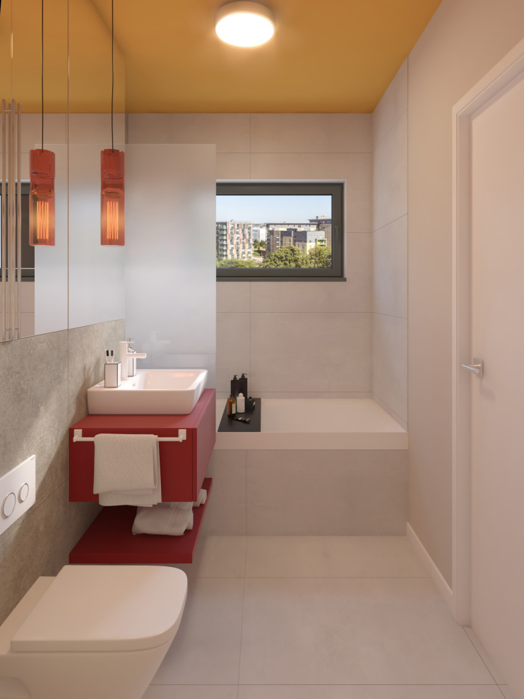 Foto på ett litet funkis röd en-suite badrum, med möbel-liknande, röda skåp, ett badkar i en alkov, en vägghängd toalettstol, vit kakel, keramikplattor, vita väggar, klinkergolv i keramik, ett fristående handfat, laminatbänkskiva, vitt golv och en dusch/badkar-kombination