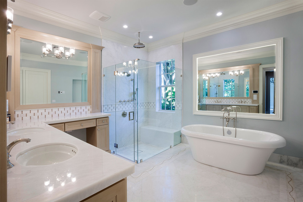 Inspiration for a large contemporary master white tile and marble tile marble floor and white floor bathroom remodel in Miami with brown cabinets, a one-piece toilet, blue walls, a hinged shower door, white countertops, recessed-panel cabinets, an undermount sink and marble countertops