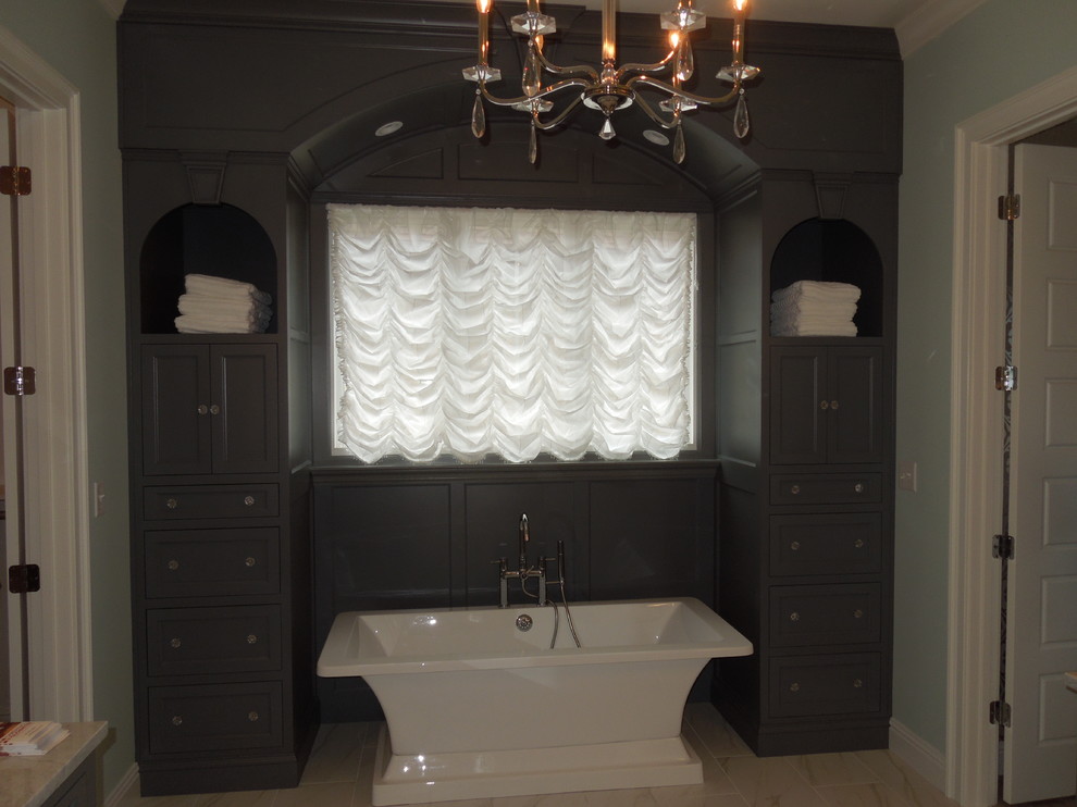 Freestanding bathtub - mid-sized traditional 3/4 porcelain tile and beige floor freestanding bathtub idea in Louisville with shaker cabinets, gray cabinets and gray walls