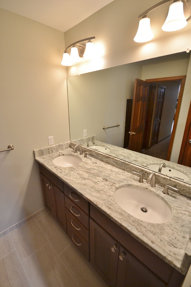 This is an example of a large traditional ensuite bathroom in Philadelphia with flat-panel cabinets, beige cabinets, a walk-in shower, a one-piece toilet, beige tiles, mosaic tiles, beige walls, ceramic flooring, a submerged sink and granite worktops.