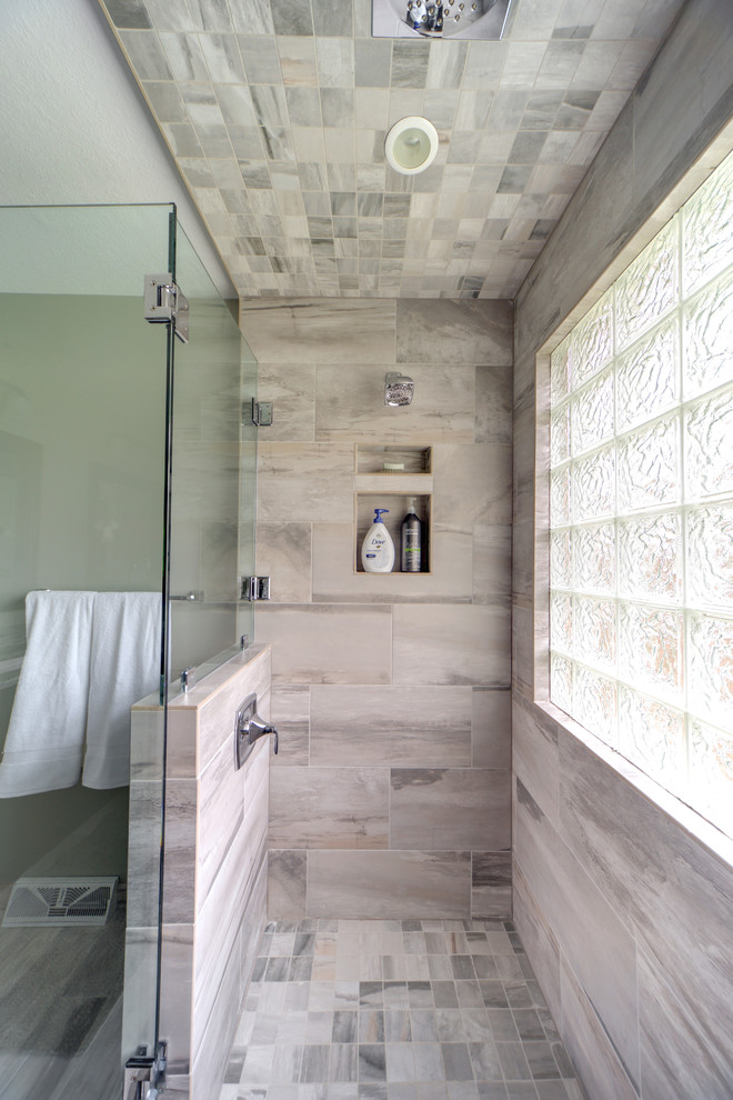 Photo of a large contemporary ensuite bathroom in Other with flat-panel cabinets, dark wood cabinets, a double shower, multi-coloured tiles, porcelain tiles, grey walls, porcelain flooring, a submerged sink and engineered stone worktops.