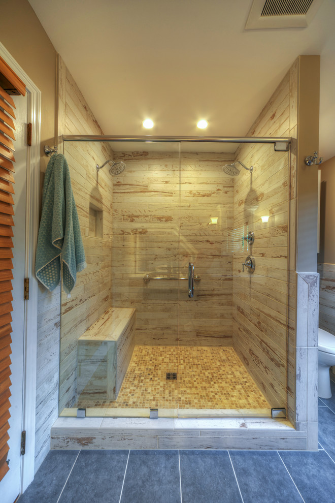 Inspiration for a large contemporary master beige tile and porcelain tile ceramic tile alcove shower remodel in Other with raised-panel cabinets, medium tone wood cabinets, beige walls, an undermount sink and quartz countertops