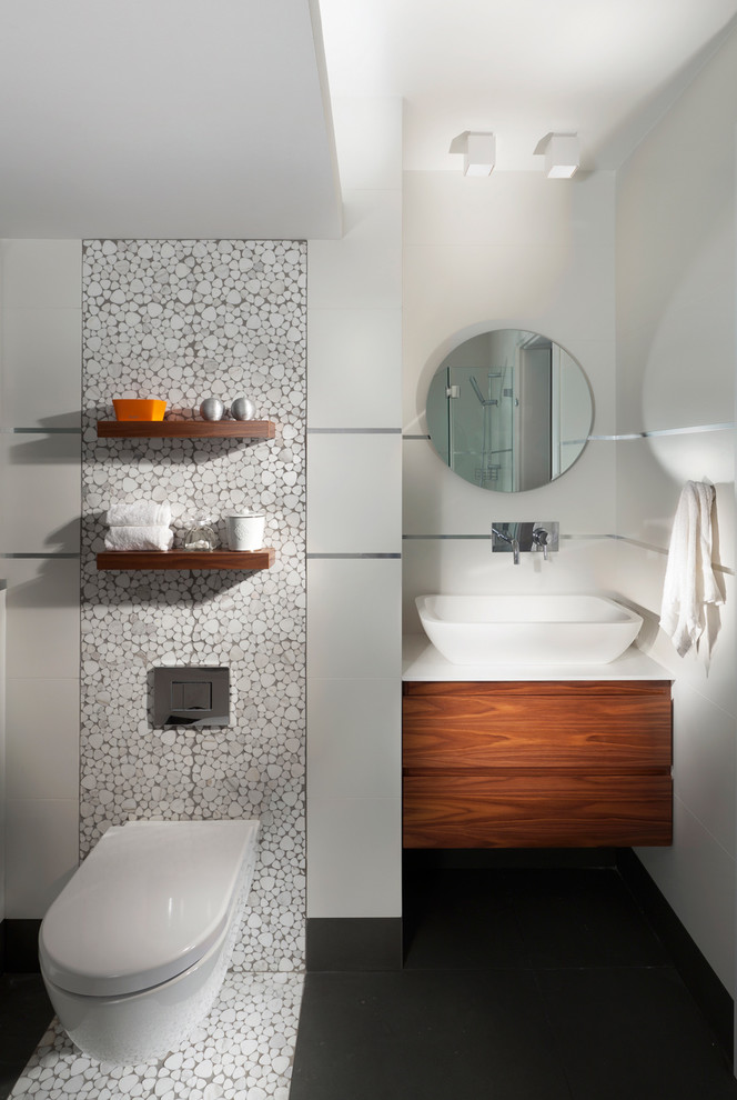 Inspiration for a contemporary bathroom remodel in Other with a vessel sink