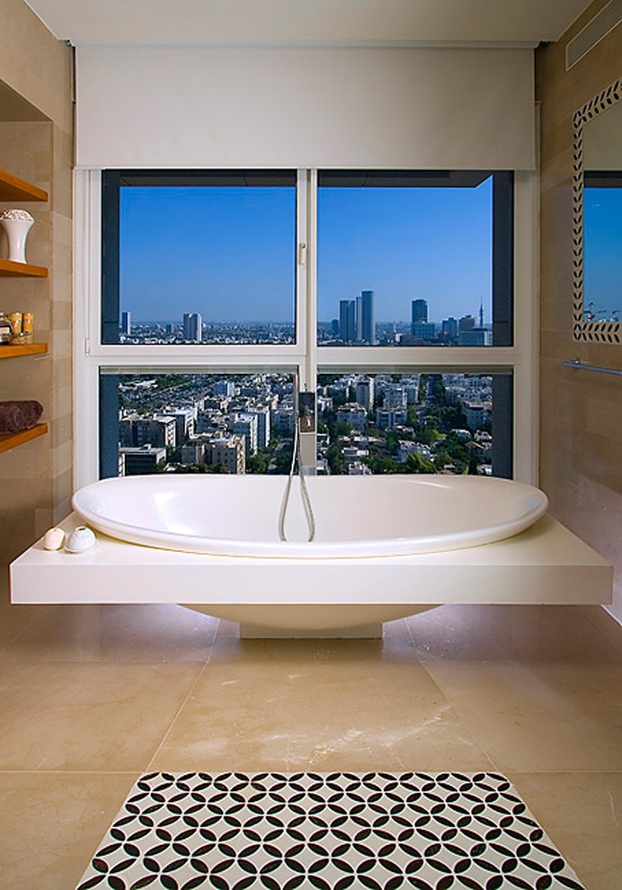 This is an example of a contemporary bathroom in Other with a freestanding bath.