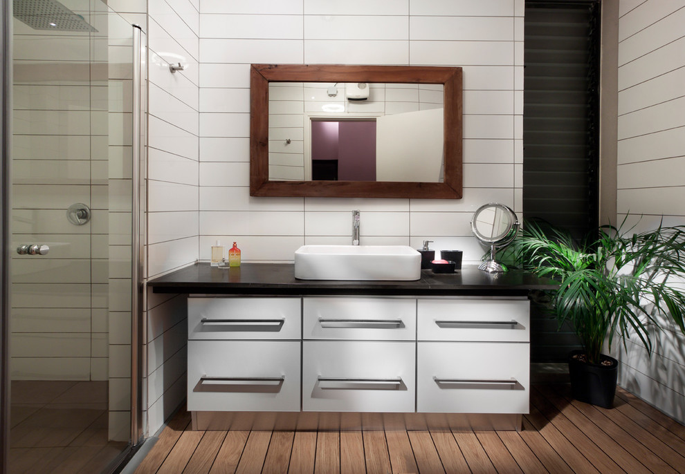 Trendy bathroom photo in Other with a vessel sink