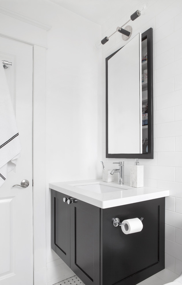 Small traditional family bathroom in Toronto with shaker cabinets, black cabinets, an alcove bath, white tiles, porcelain tiles, white walls, mosaic tile flooring, engineered stone worktops, white floors and white worktops.