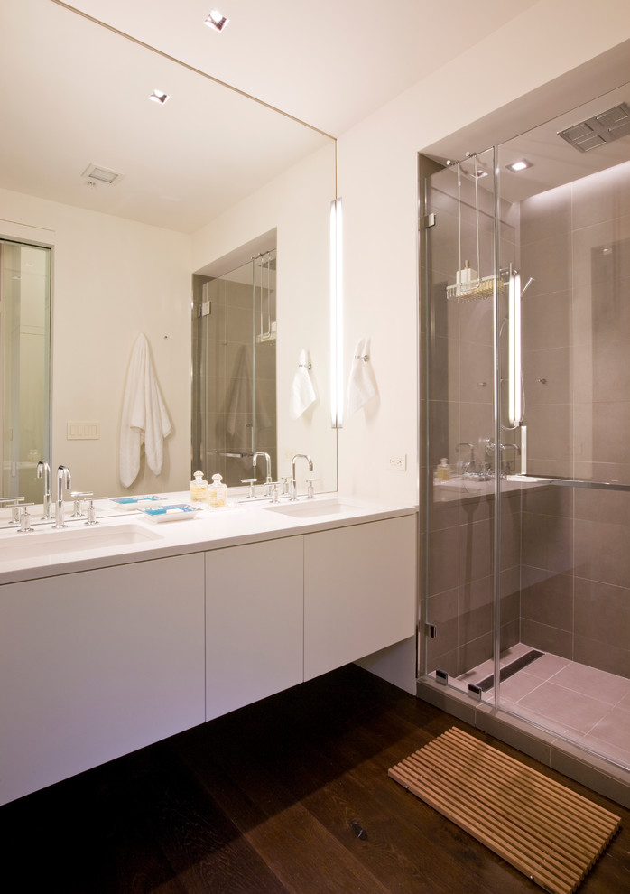 Photo of a contemporary bathroom in DC Metro with cement tiles and flat-panel cabinets.