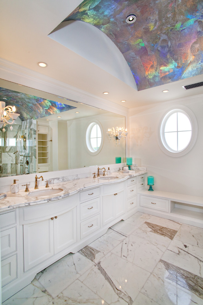 Inspiration for a large timeless master marble floor and white floor bathroom remodel in Miami with an undermount sink, beaded inset cabinets, white cabinets, white walls, marble countertops and white countertops