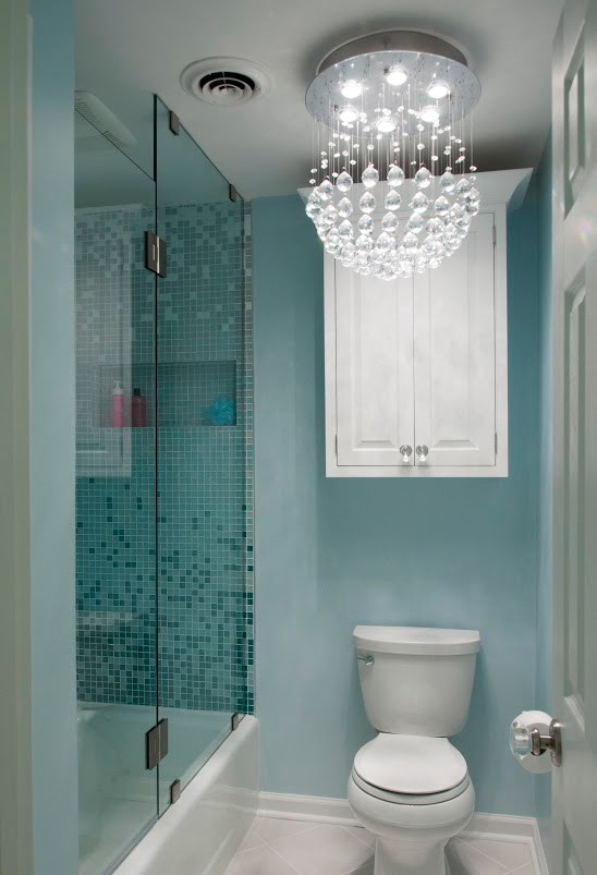 Medium sized bohemian family bathroom in Nashville with a vessel sink, beaded cabinets, white cabinets, quartz worktops, an alcove bath, an alcove shower, a two-piece toilet, white tiles, mosaic tiles, blue walls and porcelain flooring.